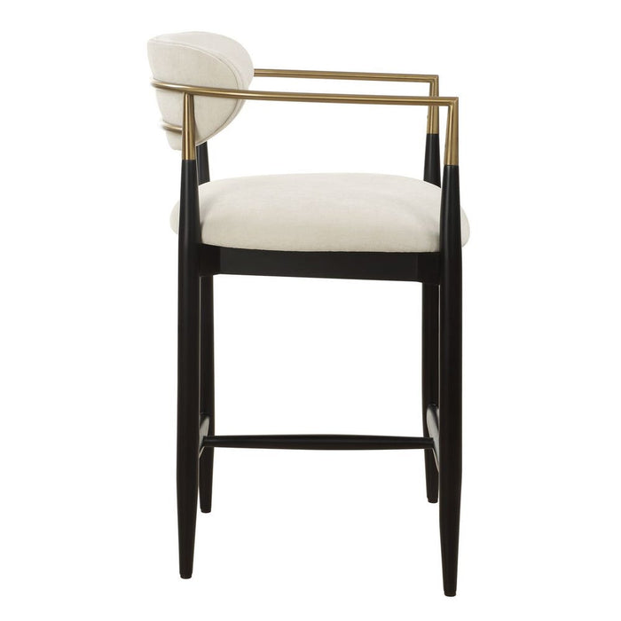 Moxie Counter Stool - matte black wood frame with brushed brass arms and off white velvet upholstery